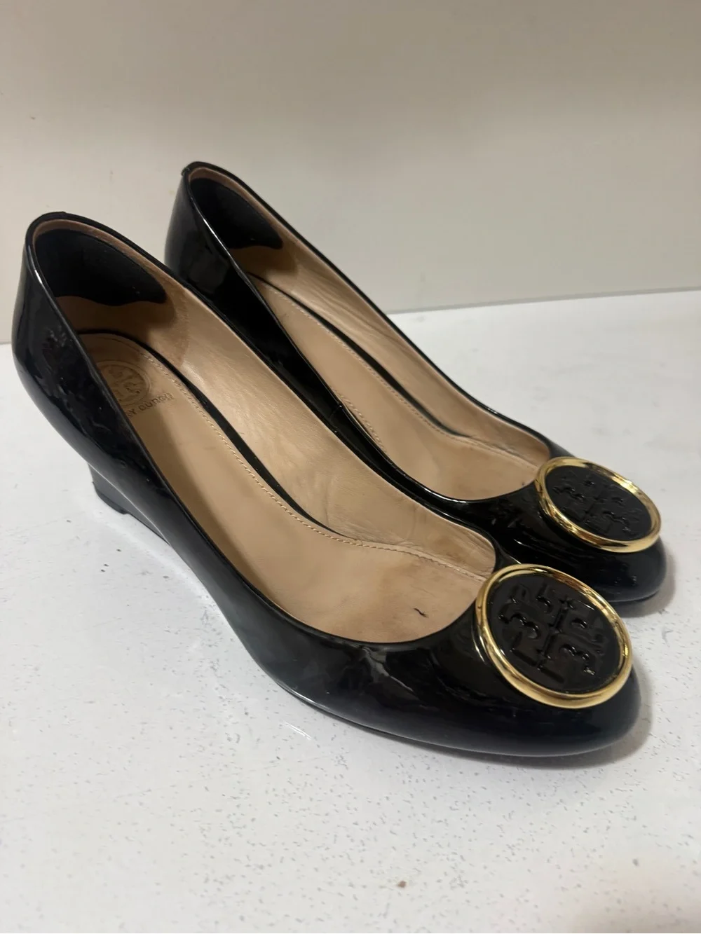 Tory Burch Black Patent Leather Wedges with Gold Logo Medallions